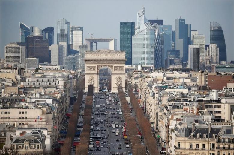 general view of the skyline of la defense business district with its arche behind paris 039 landmark the arc de triomphe and the champs elysees avenue in paris france january 13 2016 photo reuters
