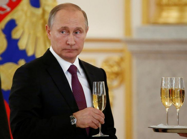 russia 039 s president vladimir putin holds a glass during a ceremony photo reuters russia 039 s president vladimir putin holds a glass during a ceremony photo reuters