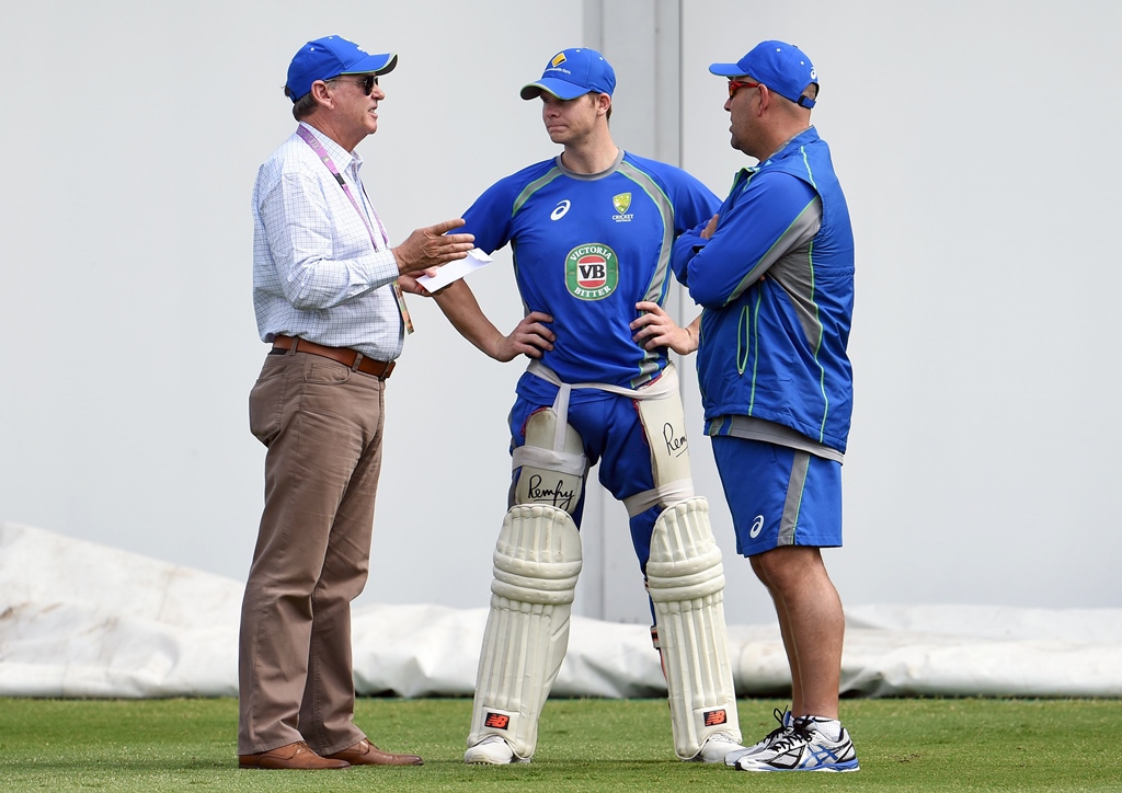 trevor hohns l speaks with team captain steve smith c chief coach darren lehmann during a training session in sydney photo afp