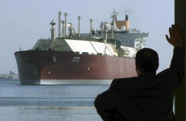 a man looks as the world 039 s biggest liquefied natural gas lng tanker duhail as she crosses through the suez canal april 1 2008 photo reuters