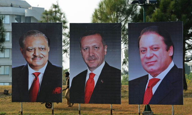 a pakistani labourer works alongside portraits of pakistan president mamnoon hussain l pakistan prime minister nawaz sharif r and visiting turkish prime minister recep tayyip erdogan c on constitution avenue in islamabad on december 22 2013 erdogan is scheduled to pay a two day official visit to pakistan from december 23 to discuss economic co operation between the two countries afp photo farooq naeem a pakistani labourer works alongside portraits of pakistan president mamnoon hussain l pakistan prime minister nawaz sharif r and visiting turkish prime minister recep tayyip erdogan c on constitution avenue in islamabad on december 22 2013 erdogan is scheduled to pay a two day official visit to pakistan from december 23 to discuss economic co operation between the two countries afp photo farooq naeem