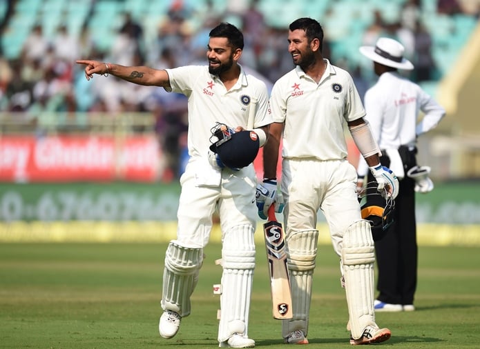 india 039 s captain virat kohli l talks with cheteshwar pujara as they walk back to pavillion for tea break during the first day of the second test cricket match between india and england at the dr y s rajasekhara reddy aca vdca cricket stadium in vishakhapatnam on november 17 2016 photo afp