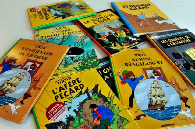 tintin books translated in several languages are displayed at the casterman publisher headquarters in brussels photo afp