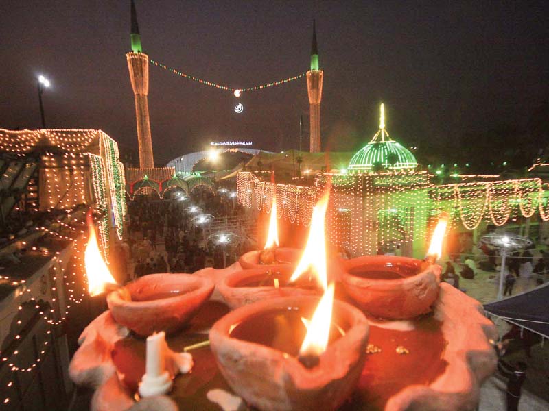 oil lamps are lighted at data darbar by the faithful photo abid nawaz express