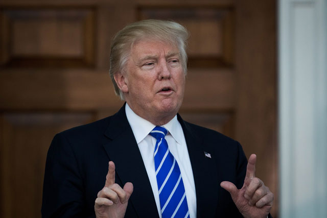 president elect donald trump speaks to reporters after his meeting with retired united states marine corps general james mattis at trump international golf club november 19 2016 in bedminster township new jersey photo afp