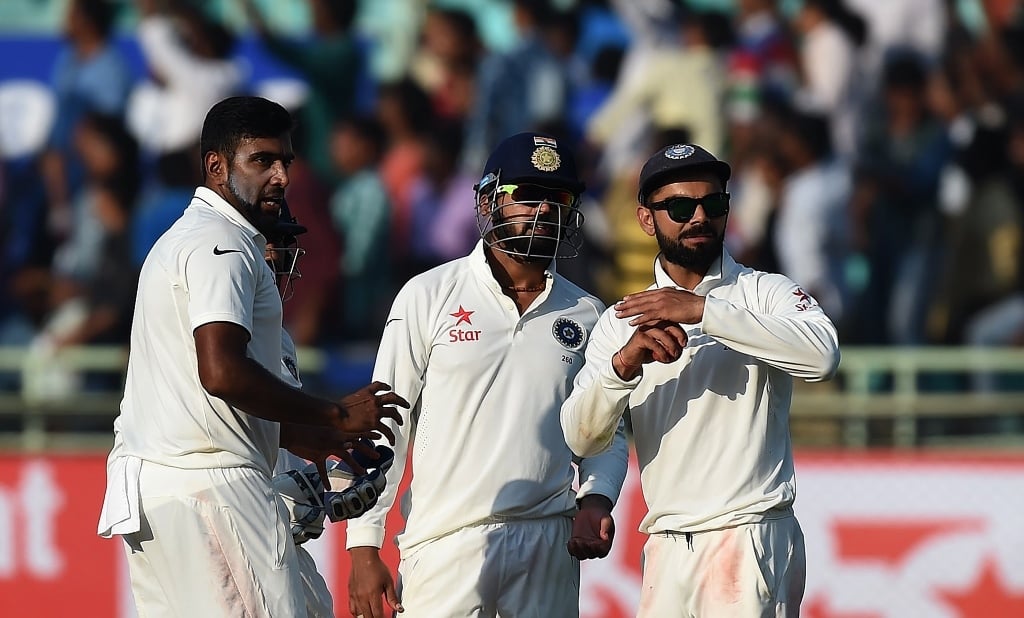 virat kohli r gestures for a decision review with ravichandran ashwin l in vishakhapatnam on november 20 2016 photo afp prakash singh