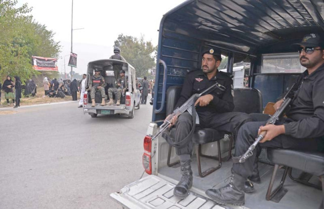 security personnel escort a chehlum procession in islamabad photo afp security personnel escort a chehlum procession in islamabad photo afp