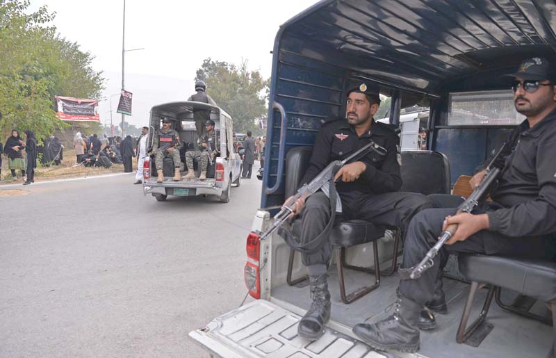 security personnel escort a chehlum procession in islamabad photo afp