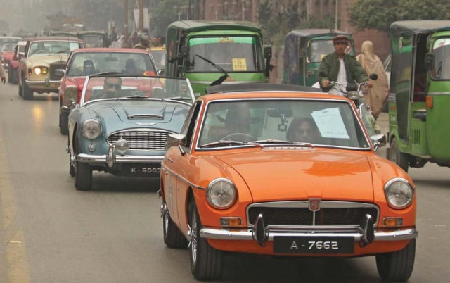 motorists take part in a vintage car rally along a road in peshawar photo ppi motorists take part in a vintage car rally along a road in peshawar photo ppi