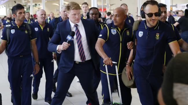 will crouch l was aggressively pulled away from du plessis r as south african team arrived at adelaide airport photo courtesy the australian