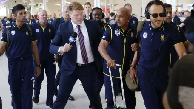 will crouch l was aggressively pulled away from du plessis r as south african team arrived at adelaide airport photo courtesy the australian will crouch l was aggressively pulled away from du plessis r as south african team arrived at adelaide airport photo courtesy the australian
