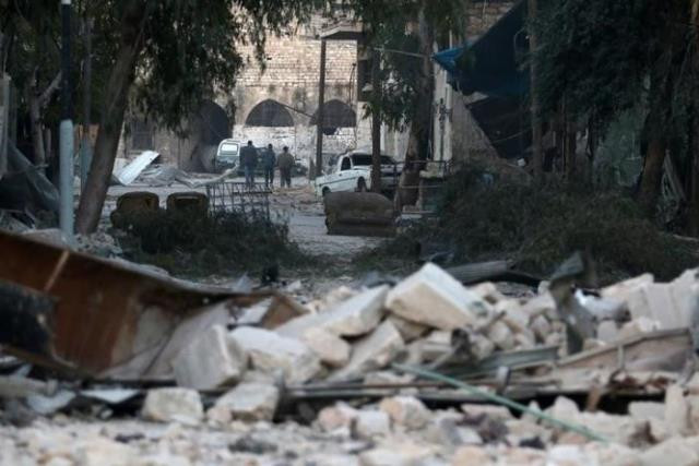 people walk near rubble of damaged buildings in the rebel held besieged area of aleppo syria november 19 2016 photo reuters people walk near rubble of damaged buildings in the rebel held besieged area of aleppo syria november 19 2016 photo reuters