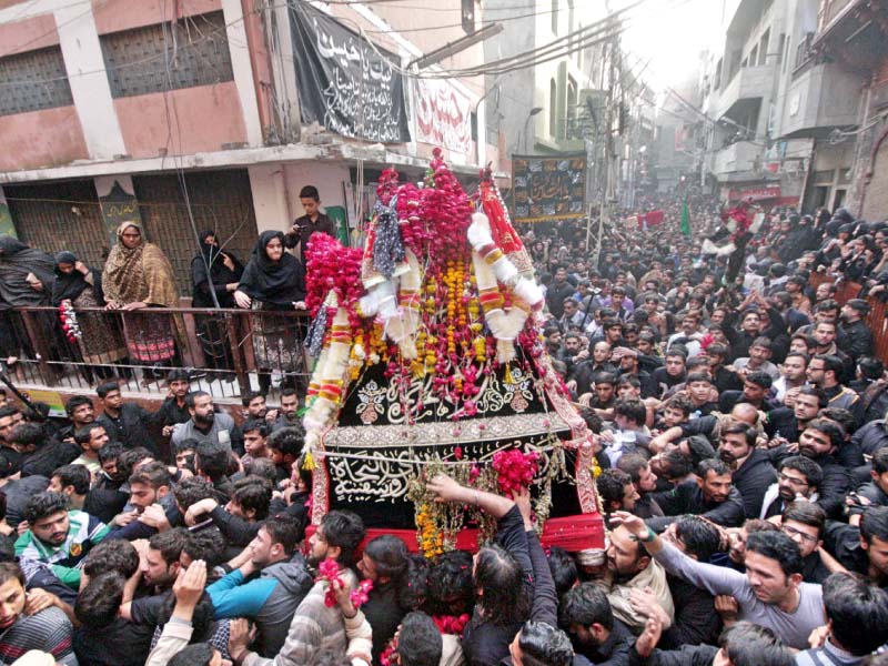 mourners carry a tazia during the main chehlum procession on monday photo abid nawaz express