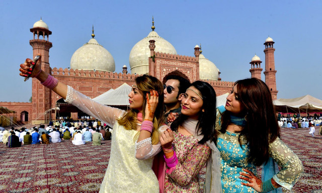 women pose for selfie after attending eidul azha prayers in lahore on september 13 2016 photo afp women pose for selfie after attending eidul azha prayers in lahore on september 13 2016 photo afp