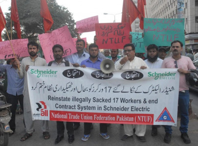 out on the streets sacked workers of schneider electric stage protest