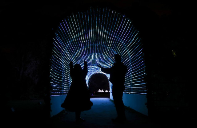 models pose for a photograph in a tunnel of lights at kew gardens in west london britain photo reuters