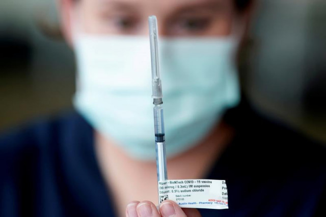 a healthcare professional prepares a dose of the pfizer coronavirus disease covid 19 vaccine as high risk workers receive the first vaccines in the state of victoria s rollout of the program in melbourne australia february 22 2021 photo reuters a healthcare professional prepares a dose of the pfizer coronavirus disease covid 19 vaccine as high risk workers receive the first vaccines in the state of victoria s rollout of the program in melbourne australia february 22 2021 photo reuters