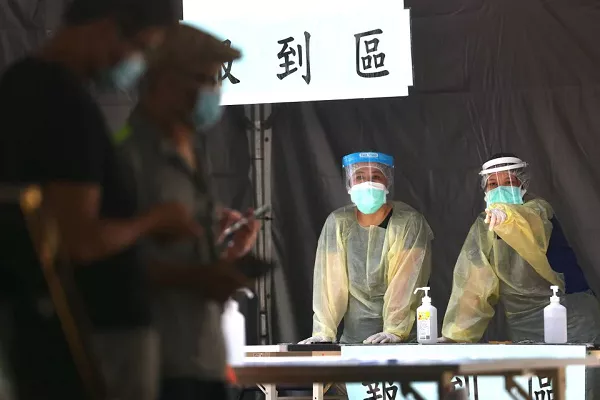 medical workers look on at the check in for people that come to do a rapid test for coronavirus disease covid 19 at a testing site following an increasing number of locally transmitted cases in taipei taiwan photo reuters medical workers look on at the check in for people that come to do a rapid test for coronavirus disease covid 19 at a testing site following an increasing number of locally transmitted cases in taipei taiwan photo reuters