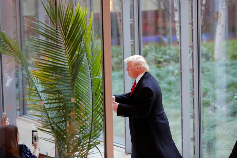 president elect donald trump gestures to diners as he departs the lobby of the new york times building photo reuters