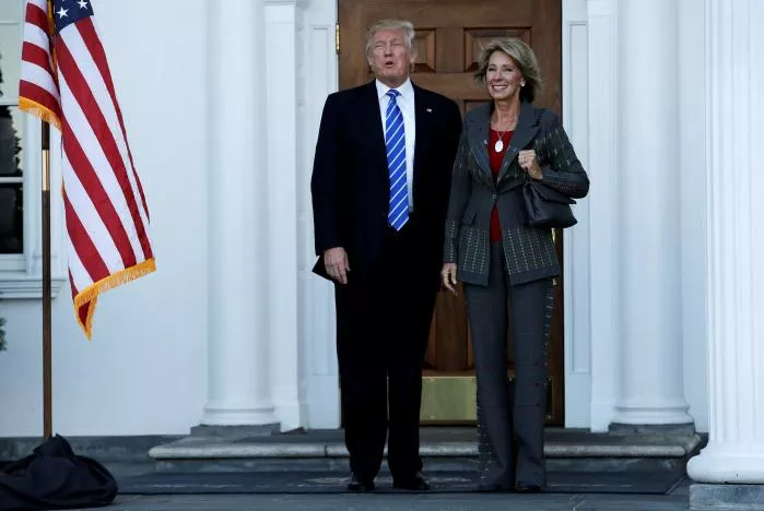 us president elect donald trump l stands with betsy devos after their meeting at the main clubhouse at trump national golf club in bedminster new jersey us photo reuters us president elect donald trump l stands with betsy devos after their meeting at the main clubhouse at trump national golf club in bedminster new jersey us photo reuters