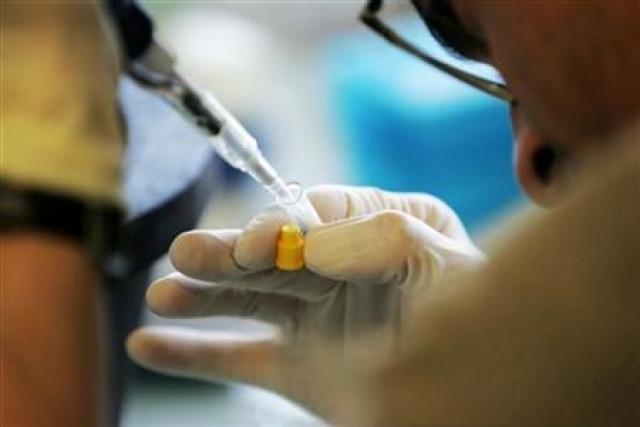 a laboratory researcher in a file photo reuters sebastian derungs a laboratory researcher in a file photo reuters sebastian derungs