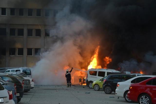 a firefighter tries to extinguish burning vehicles after an explosion outside the governor 039 s office in the southern city of adana turkey november 24 2016 ihlas news photo reuters