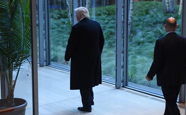 us president elect donald trump leaves after a meeting at the new york times on november 22 2016 in new york us president elect trump said tuesday he has an open mind about pulling out of world climate accords and admitted global warming may be in some way linked to human activity quot i think there is some connectivity some something it depends on how much quot he told a panel of new york times journalists photo afp