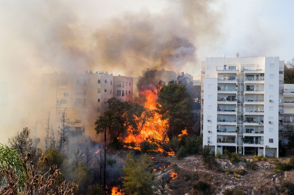 flames 10 metres more than 30 feet high were threatening several multi storey tower blocks in haifa photo afp