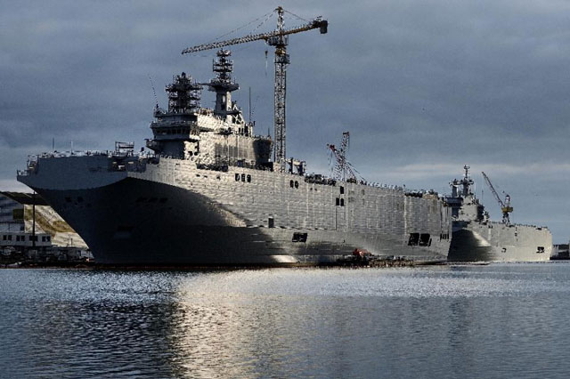 a picture shows the sevastopol l and the vladivostok warships two mistral class lhd amphibious vessels ordered by russia from stx france in saint nazaire western france on december 20 2014 photo afp