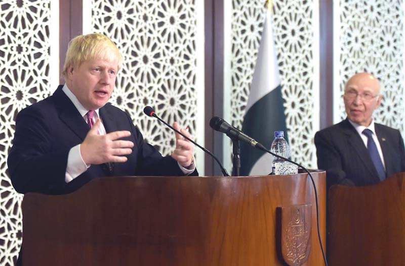 british foreign secretary boris johnson speaks during a joint press conference with adviser to the prime minister on foreign affairs sartaj aziz at the foreign ministry in islamabad photo afp