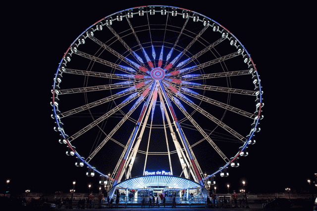 this picture taken in paris shows the ferris wheel set on the place de la concorde on the day fairground stallhorders blocked the access to the area to protest against the request from the state to remove it photo afp