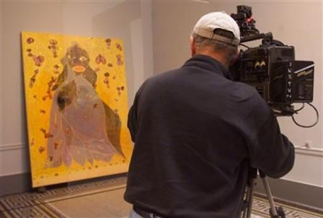 a cameraman shoots an elephant dung stained portrait of the virgin mary by artist chris ofili during a preview of an exhibit of young british artists called quot sensation quot at the brooklyn museum of art in new york photo reuters a cameraman shoots an elephant dung stained portrait of the virgin mary by artist chris ofili during a preview of an exhibit of young british artists called quot sensation quot at the brooklyn museum of art in new york photo reuters