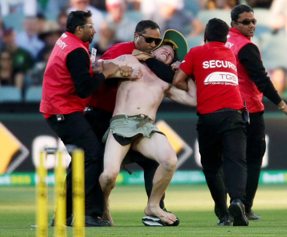 a streaker is evicted from the pitch during the third day of the third test cricket match in adelaide between australia and south africa photo reuters