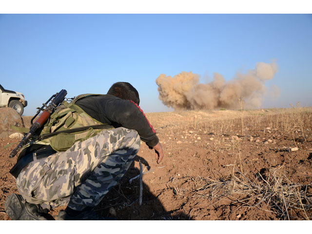 a rebel fighter reacts as a landmine planted by islamic state is group militants is exploded by his comrades in the village of tilalayn on the western outskirts of the northern syrian town of dabiq on november 25 2016 photo afp