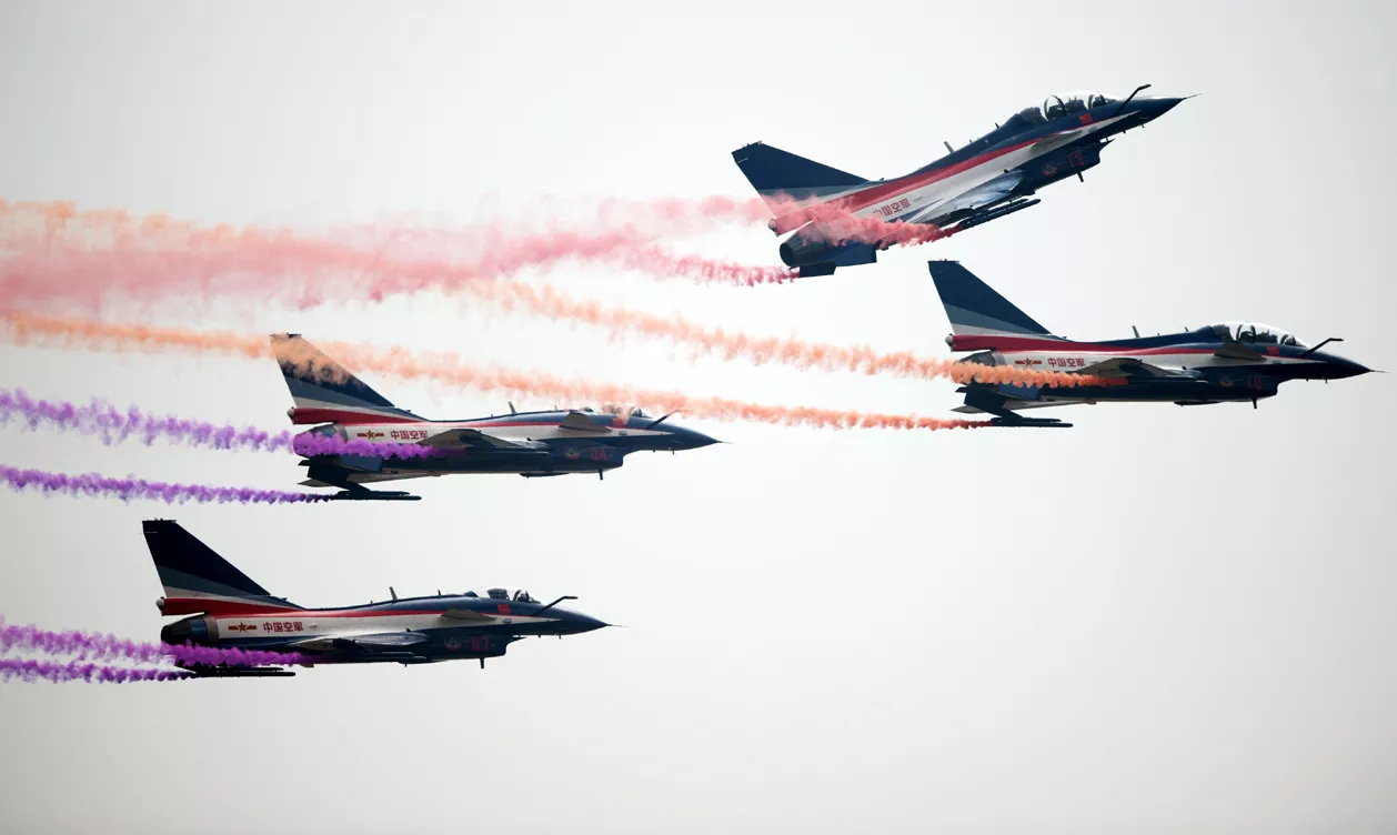 j 10 fighter jets of the bayi aerobatic team of pla 039 s peoples liberation army air force performing during the 10th china airshow photo afp j 10 fighter jets of the bayi aerobatic team of pla 039 s peoples liberation army air force performing during the 10th china airshow photo afp