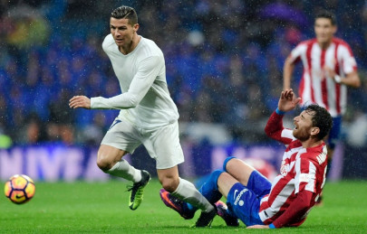 ronaldo double extends real lead sevilla up to second