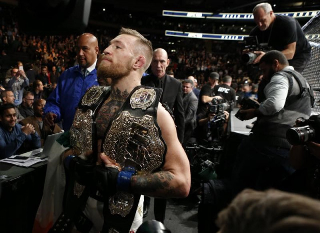 conor mcgregor with his two championship belts at madison square garden photo reuters adam hunger usa today sports conor mcgregor with his two championship belts at madison square garden photo reuters adam hunger usa today sports