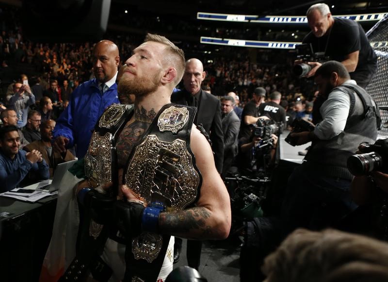 conor mcgregor with his two championship belts at madison square garden photo reuters adam hunger usa today sports