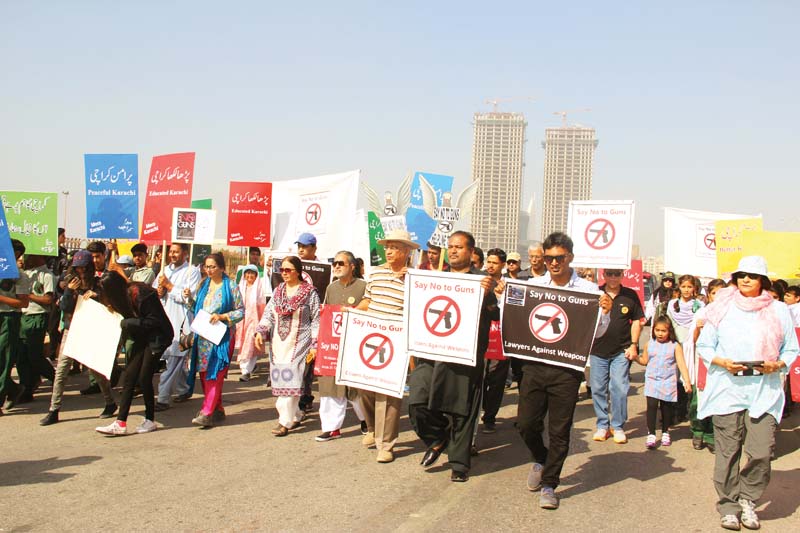 citizens against weapons organised a walk from sea view mcdonald s to chunky monkey to raise voice for a society free of weapons and to spread the message of peace and harmony photos ayesha mir express