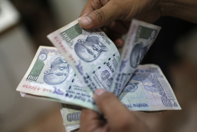 an employee counts indian rupee currency notes inside a private money exchange office in new delhi july 5 2013 india 039 s central bank was seen selling dollars via state run banks on friday as the rupee approached its record low of 60 76 seen on june 26 four dealers said reuters adnan abidi india tags business rtx11dcr an employee counts indian rupee currency notes inside a private money exchange office in new delhi july 5 2013 india 039 s central bank was seen selling dollars via state run banks on friday as the rupee approached its record low of 60 76 seen on june 26 four dealers said reuters adnan abidi india tags business rtx11dcr