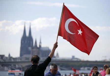 a demonstrator waves a turkish flag during a rally photo reuters