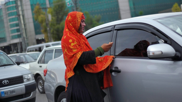 a transgender woman begs for alms from motorists at a traffic stop in rawalpindi outside islamabad pakistan on march 27 photo npr