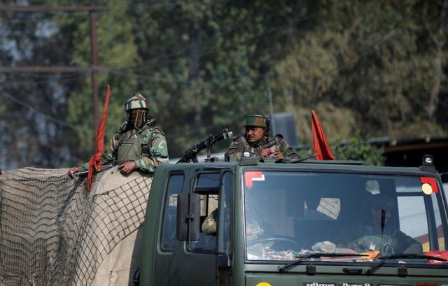 indian army soldiers keep guard on top of a vehicle along a highway on the outskirts of srinagar october 3 2016 reuters danish ismail