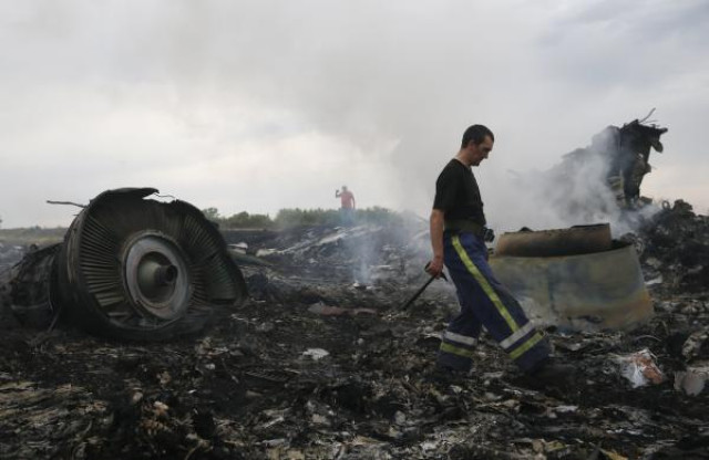 emergencies ministry member walks at the site of a malaysia airlines boeing 777 plane crash near the settlement of grabovo in the donetsk region photo reuters emergencies ministry member walks at the site of a malaysia airlines boeing 777 plane crash near the settlement of grabovo in the donetsk region photo reuters