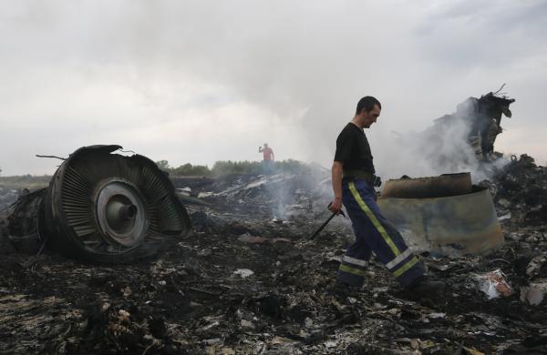 emergencies ministry member walks at the site of a malaysia airlines boeing 777 plane crash near the settlement of grabovo in the donetsk region photo reuters