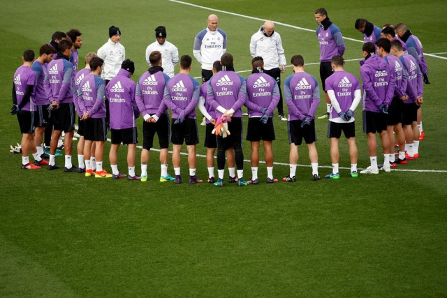 real madrid players observe a minute of silence photo reuters juan medina
