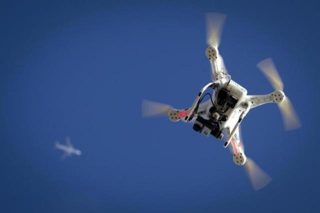 an airplane flies over a drone during the polar bear plunge on coney island photo reuters