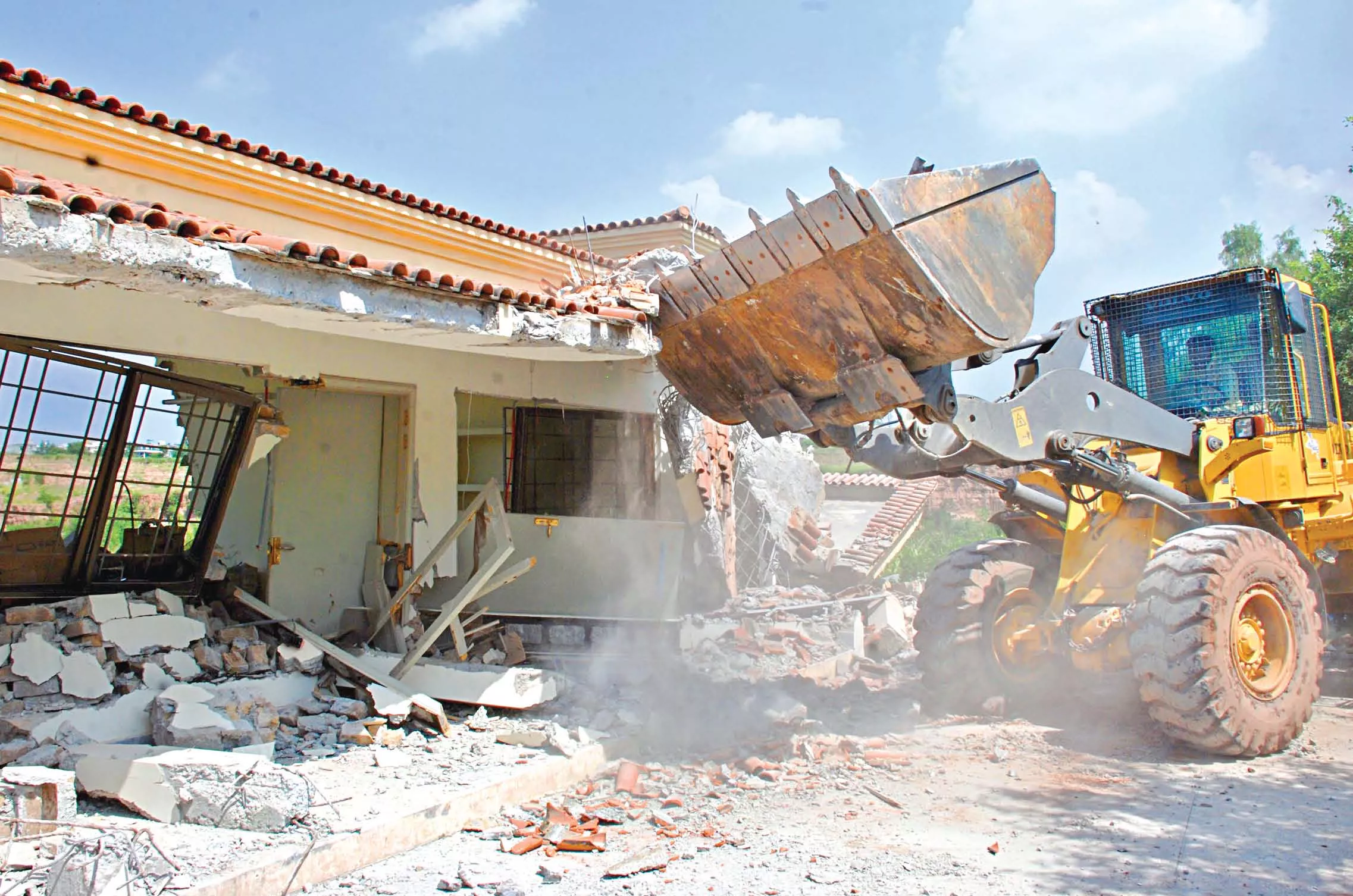 in the operation which started on tuesday a cda bulldozer demolishes illegal construction at a farm in the orchard scheme on murree road photo muhammad javaid in the operation which started on tuesday a cda bulldozer demolishes illegal construction at a farm in the orchard scheme on murree road photo muhammad javaid