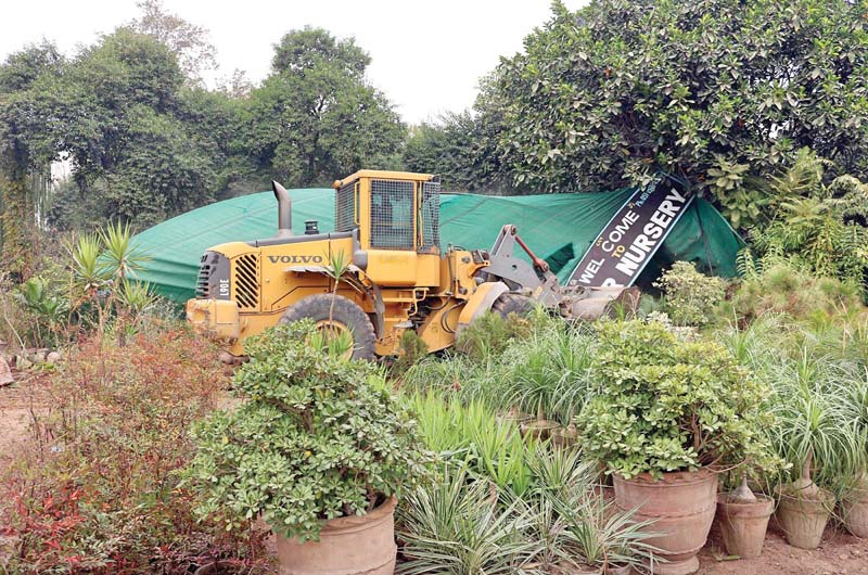 cda workers demolish one of the illegal nurseries on park road photo inp