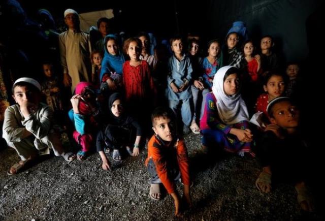 afghan refugee children returning from pakistan watch a short video clip about mines during a mines and explosives awareness program at a united nations high commissioner for refugees unhcr registration centre in kabul afghanistan september 27 2016 photo reuters
